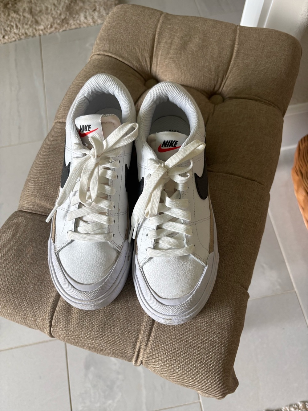 Nike white and black platform sneakers.